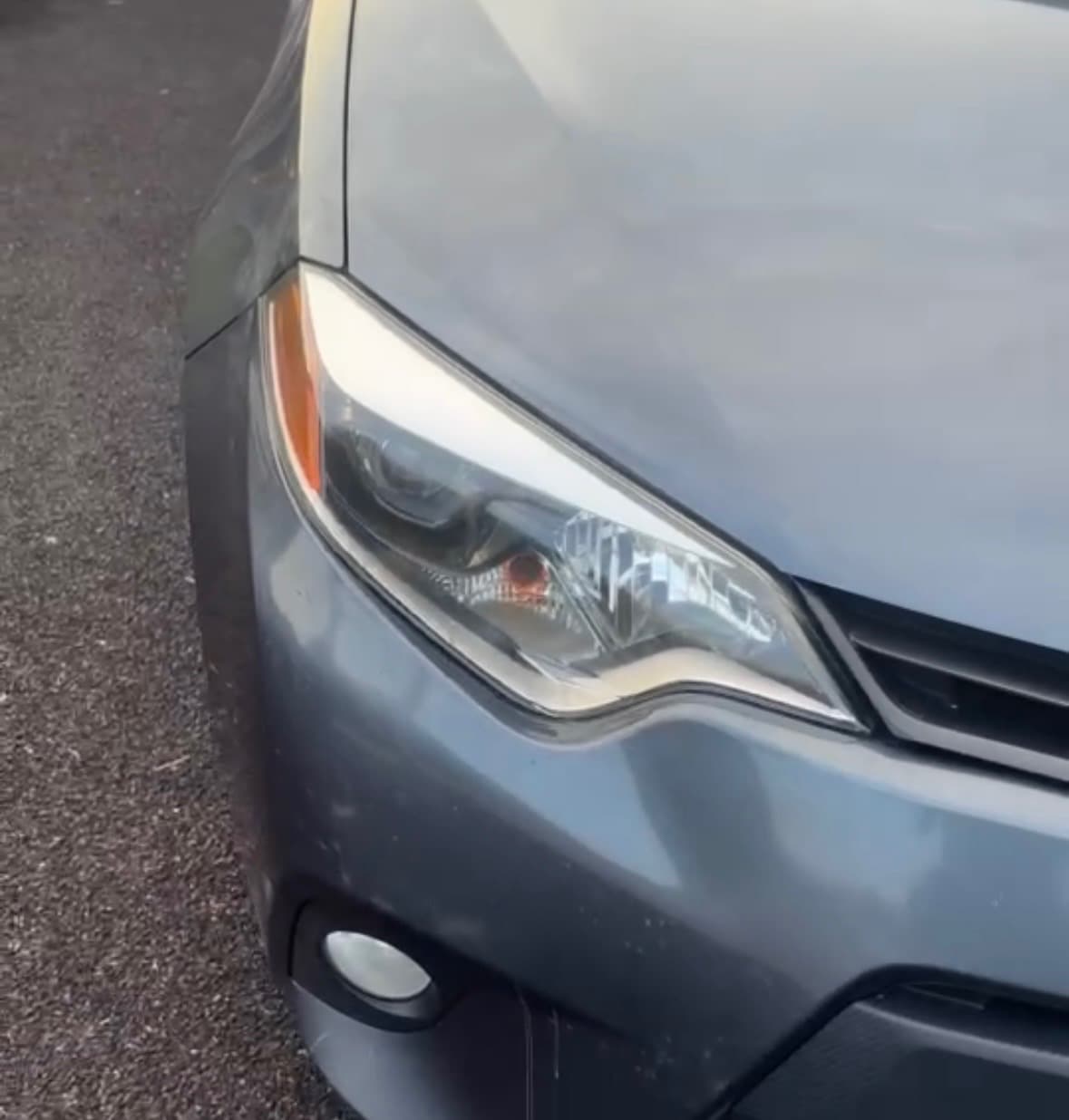 Clear, polished headlight lens with full optical clarity after restoration